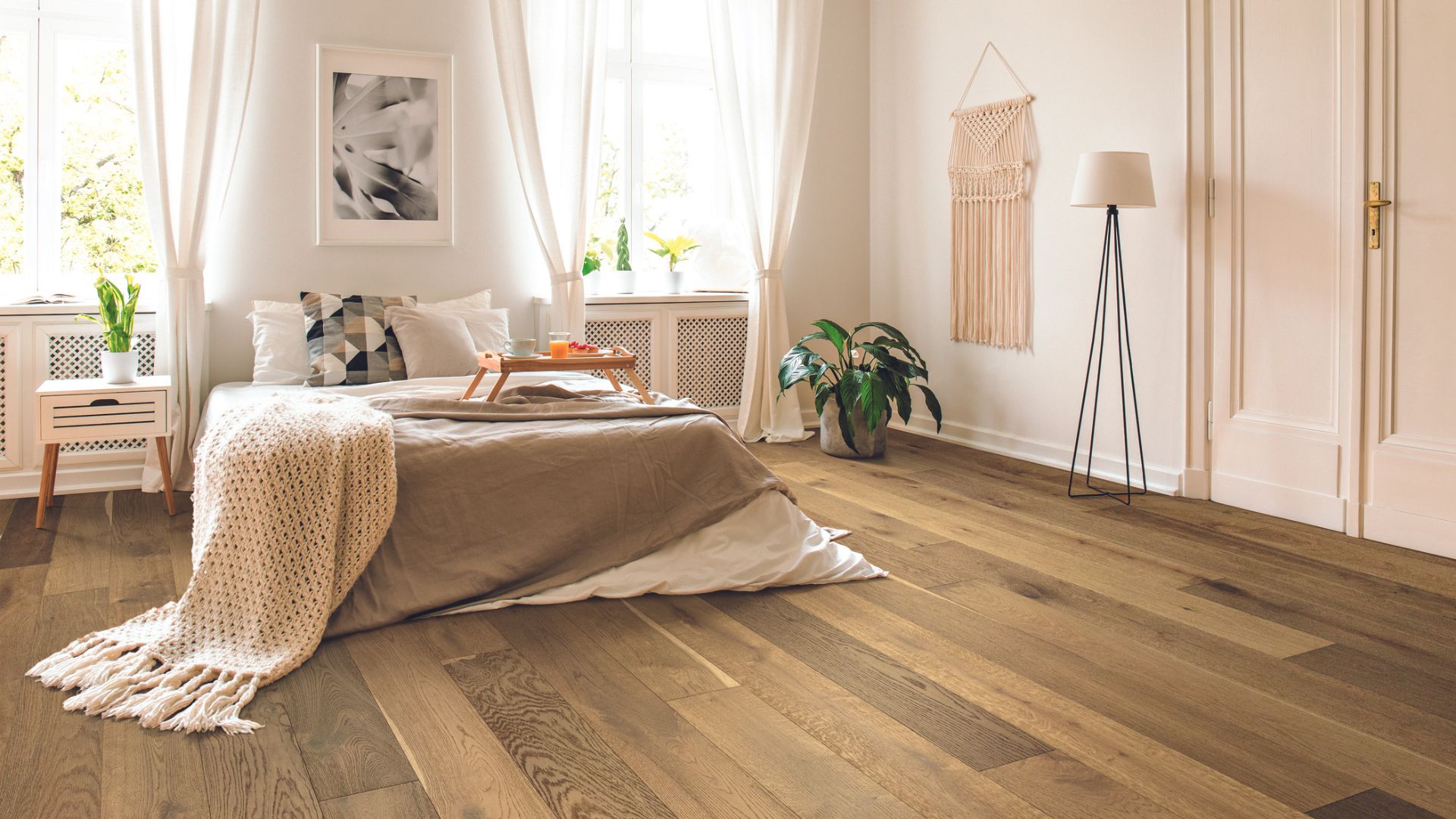 Laminate wood flooring in a bedroom.